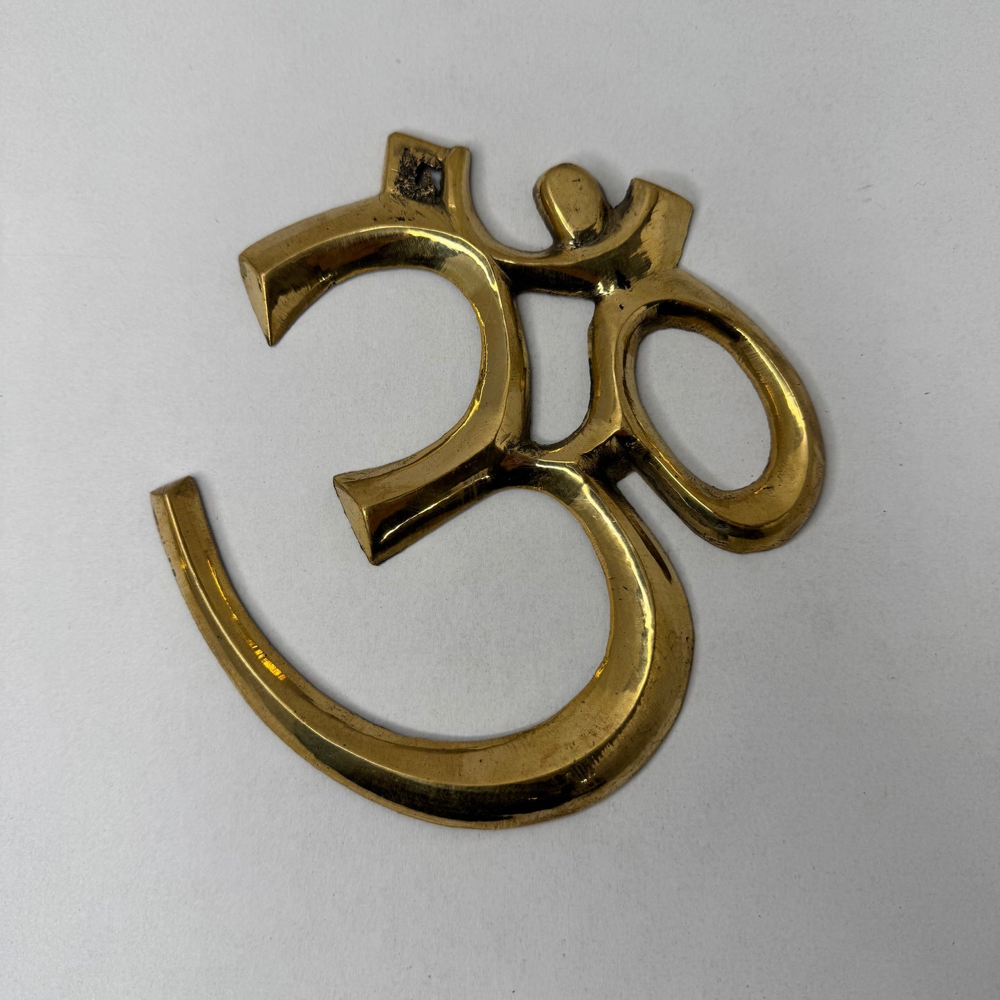 Handcrafted Brass Om Wall Décor – Spiritual and Elegant