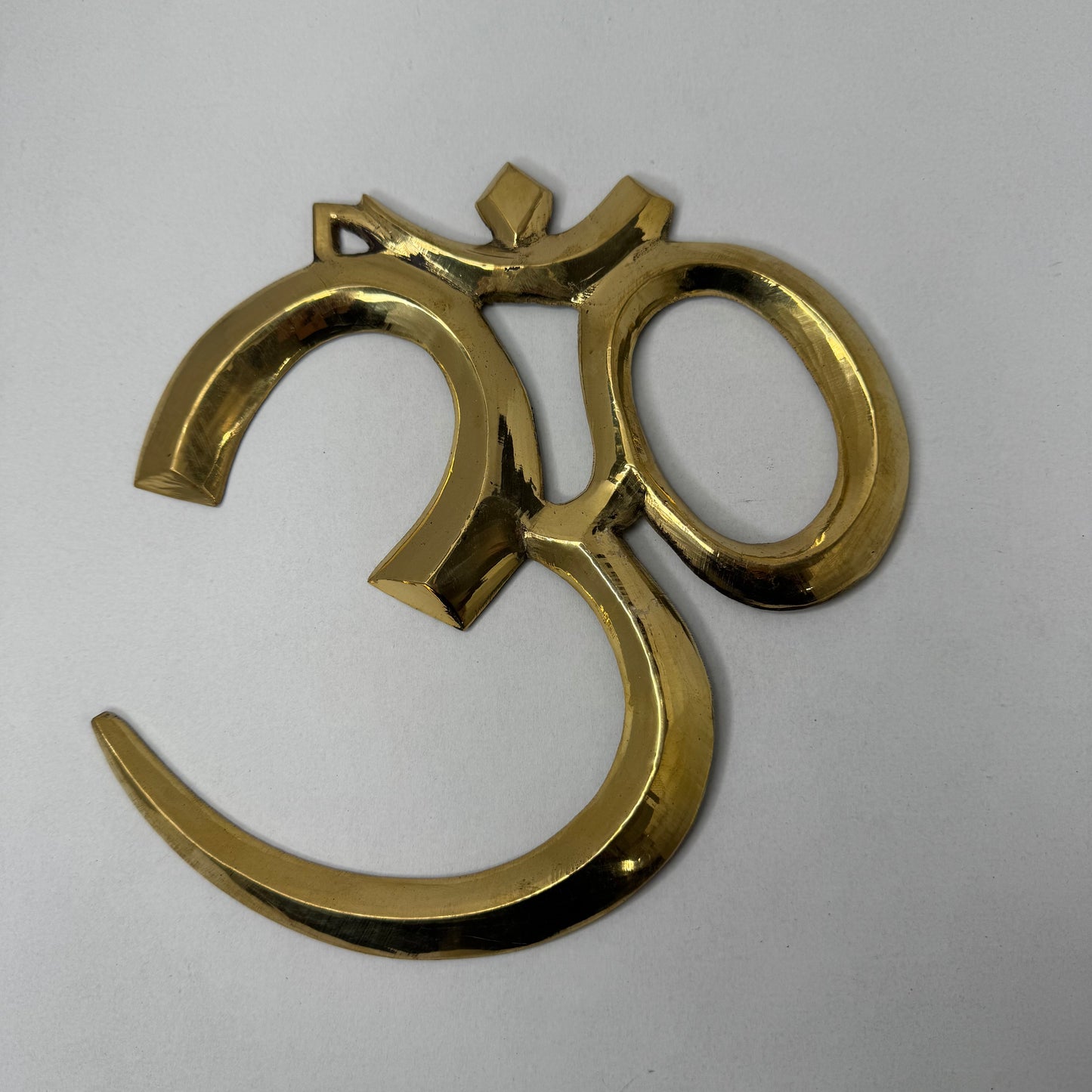 Handcrafted Brass Om Wall Décor – Spiritual and Elegant