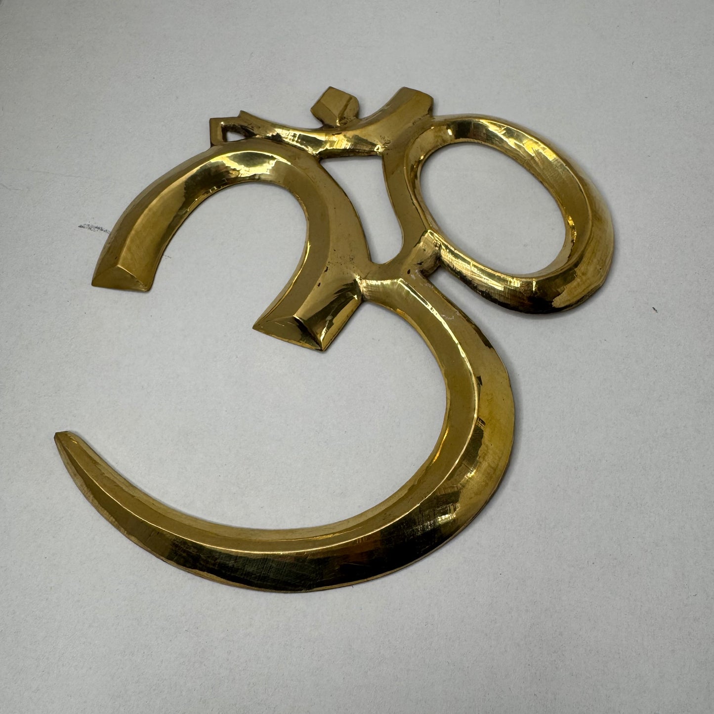 Handcrafted Brass Om Wall Décor – Spiritual and Elegant