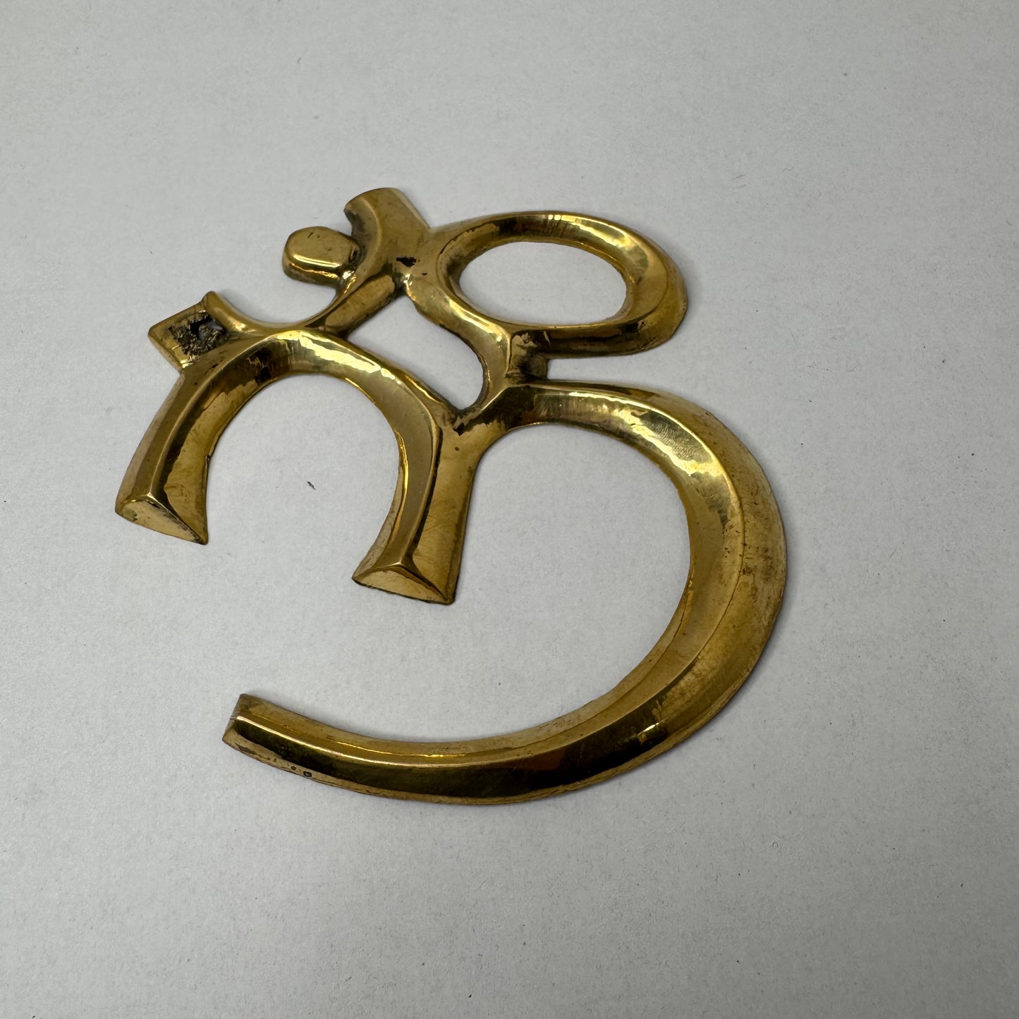 Handcrafted Brass Om Wall Décor – Spiritual and Elegant